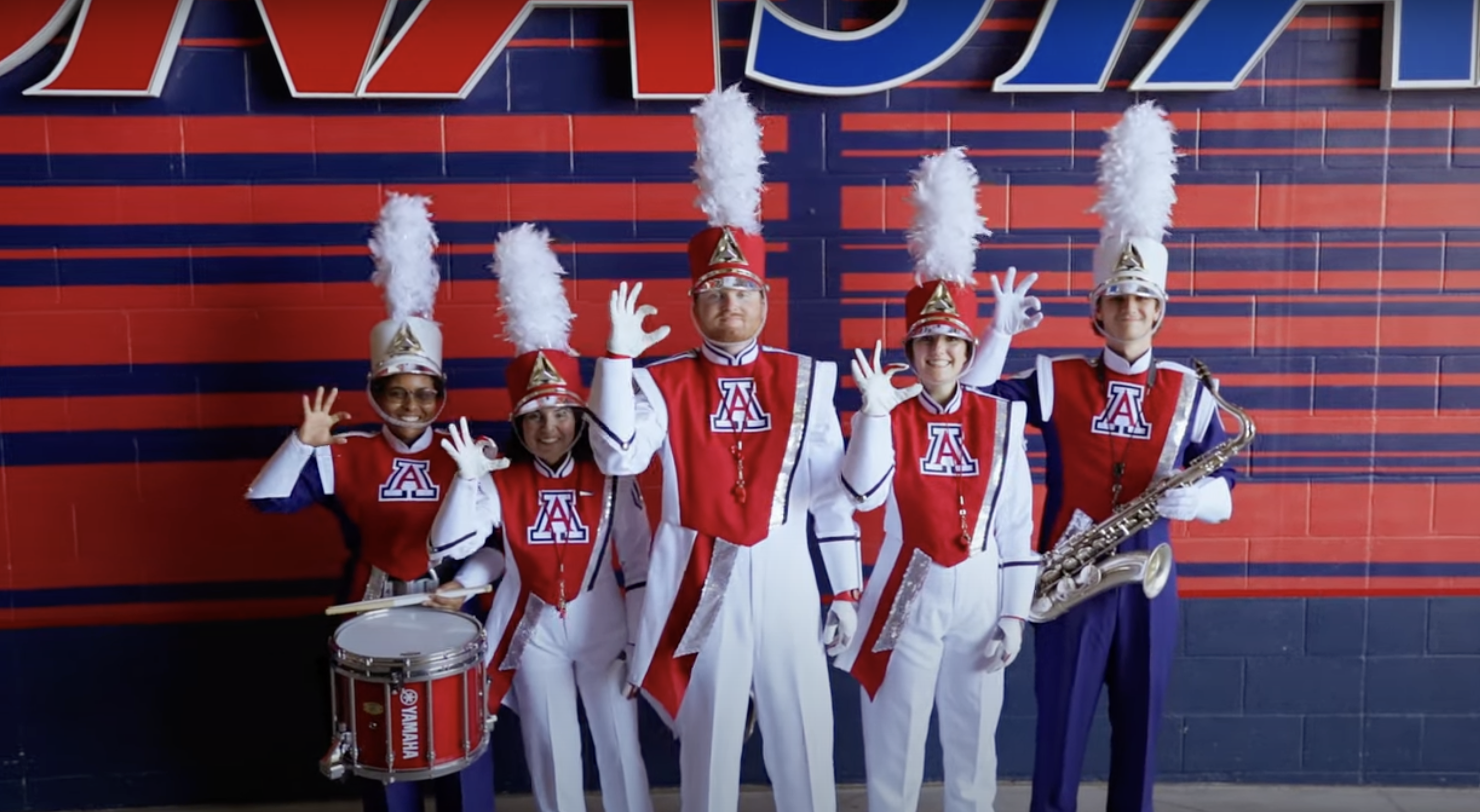 Drum majors and band members from the Pride of Arizona debut new uniforms.